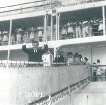 Dr William B Walsh and Mrs Walsh behind him coming down gangway.